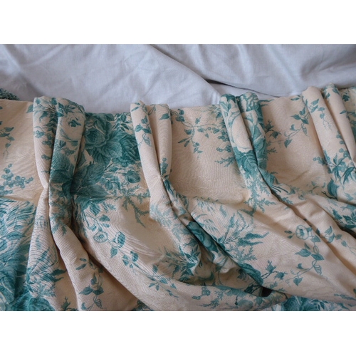 251 - A pair of curtains in a cream and green patterned silk effect damask with a green floral print, thic... 