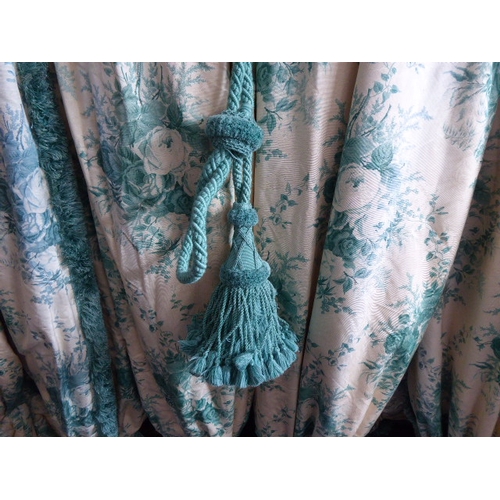 251 - A pair of curtains in a cream and green patterned silk effect damask with a green floral print, thic... 