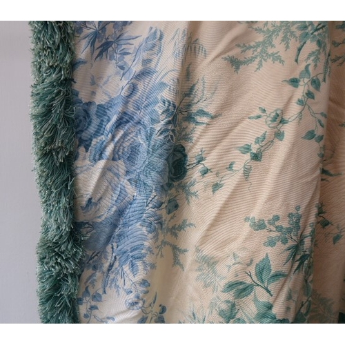 251 - A pair of curtains in a cream and green patterned silk effect damask with a green floral print, thic... 