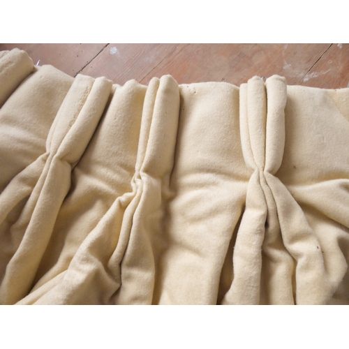 253 - A pair of brushed wool camel-coloured curtains; triple pinch pleat heading, heavy duty thermal linin... 