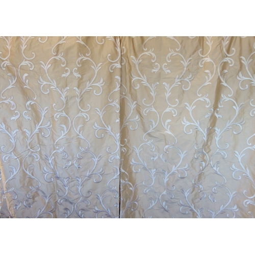 262 - A pair of Colefax & Fowler curtains in champagne silk decorated with machine embroidery; goblet head... 