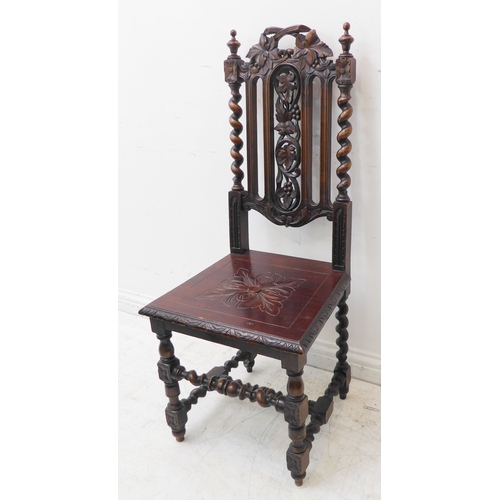 274 - A late 19th century carved oak hall-style chair: the pierced vertical splats decorated in relief wit... 