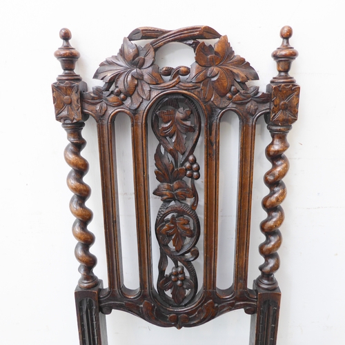 274 - A late 19th century carved oak hall-style chair: the pierced vertical splats decorated in relief wit... 