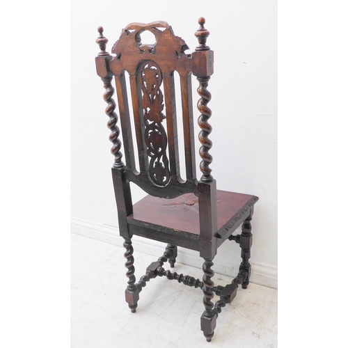 274 - A late 19th century carved oak hall-style chair: the pierced vertical splats decorated in relief wit... 