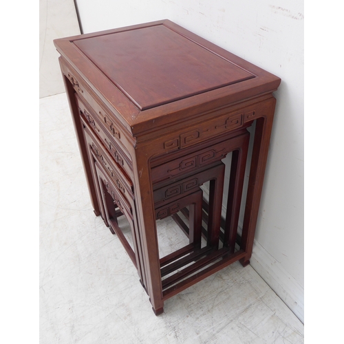 305 - A good nest of four early-style (later) Chinese hardwood occasional tables: each frieze carved in re... 