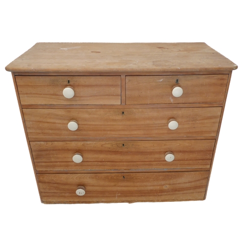 306 - A 19th century pine chest: two half-width over three full-width graduated drawers with white painted... 