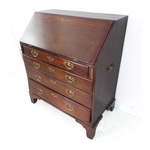 316 - An 18th century mahogany writing bureau: the angular cleated fall opening to reveal fully-fitted int... 