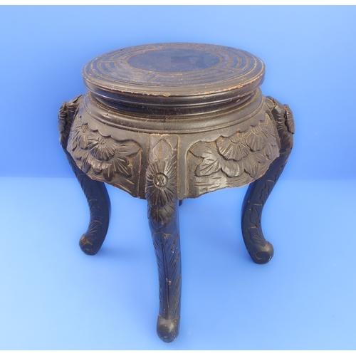 331 - An early 20th century Chinese ebonised carved wood  jardinière stand of small proportions: circular ... 