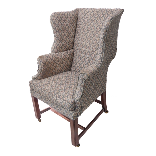 376 - An early 20th century wing-backed library armchair in mid-18th century style and of small and pleasi... 