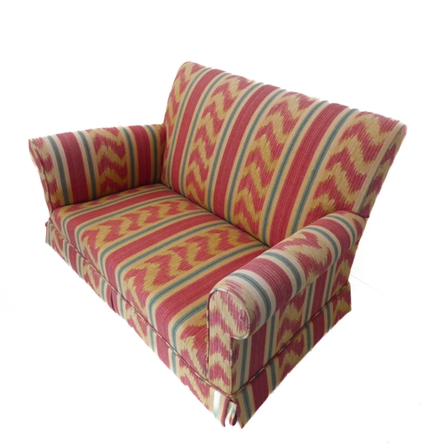 381 - A brightly upholstered two-seater sofa with reds, creams, greens, blues etc. (133cm wide x 90cm deep... 