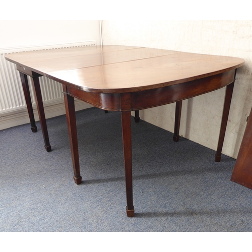 389 - A large 19th century extending mahogany D-end dining table with two extra leaves: raised on square t... 