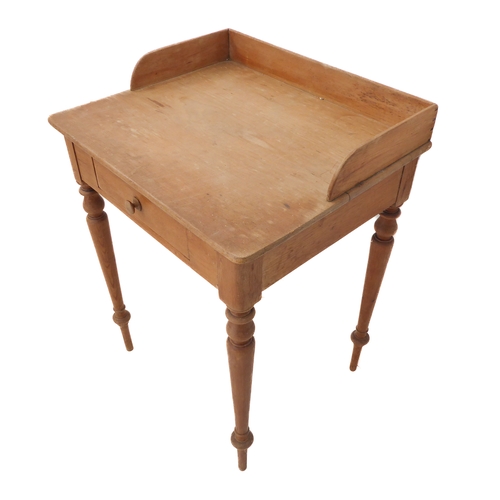 396 - A late 19th century pine washstand: three-quarter galleried top above a single drawer and turned tap... 