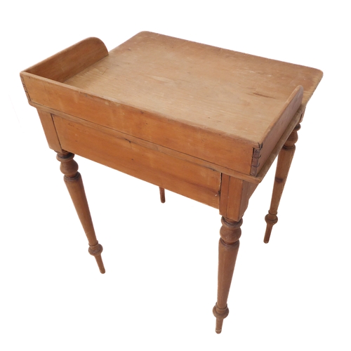 396 - A late 19th century pine washstand: three-quarter galleried top above a single drawer and turned tap... 