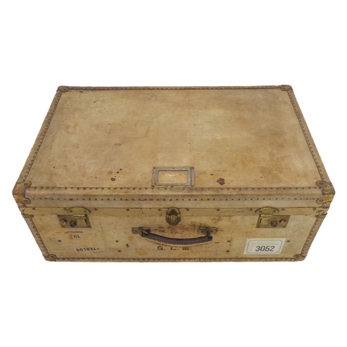 434 - A large vellum style brass-bound travelling suitcase (77cm wide x 48cm deep x 30cm high)