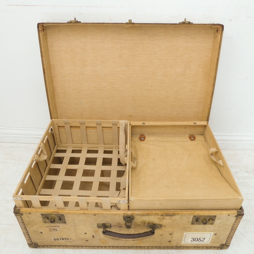 434 - A large vellum style brass-bound travelling suitcase (77cm wide x 48cm deep x 30cm high)