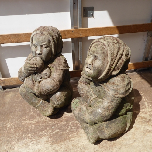 444 - Two similar re-constituted stone garden statues by Alan Brough and modelled as seated children (in I... 