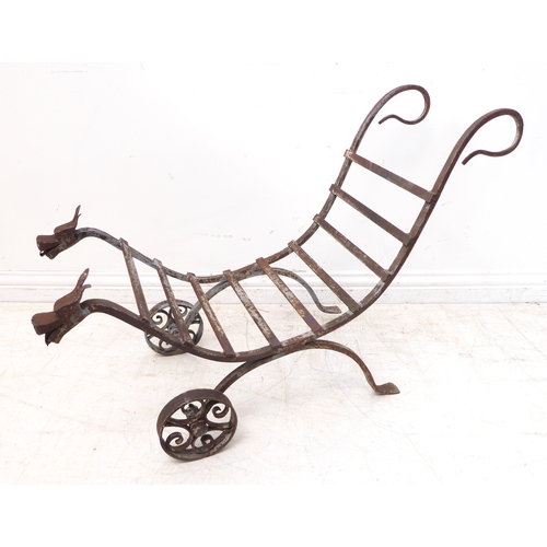 445 - An unusual blacksmith-made wrought-iron garden stand of cradle form. Two looping handles above horiz... 