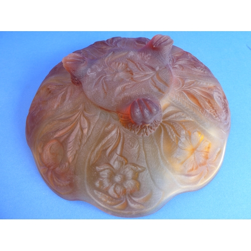 62 - A large 1920s moulded amber glass flowerhead-shaped dish decorated with moulded flowers and leaves, ... 