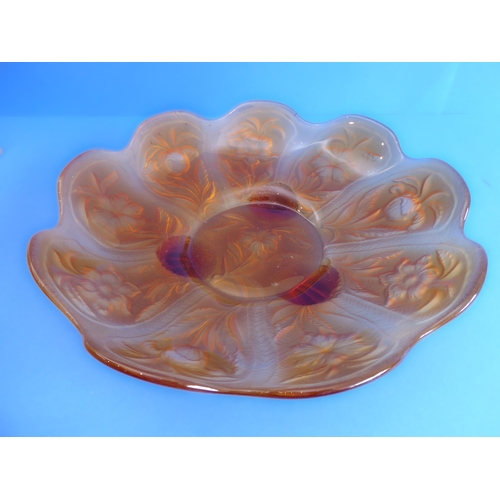 62 - A large 1920s moulded amber glass flowerhead-shaped dish decorated with moulded flowers and leaves, ... 