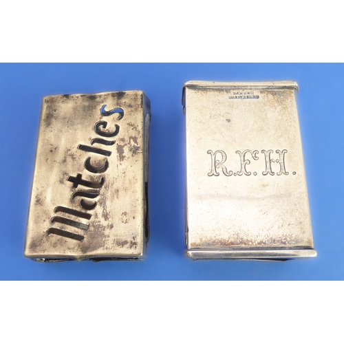 83 - A silver cigarette case and two matchbox-holders:
 the early 20th century hallmarked silver kidney-s... 