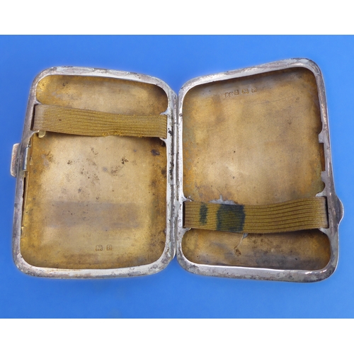 83 - A silver cigarette case and two matchbox-holders:
 the early 20th century hallmarked silver kidney-s... 