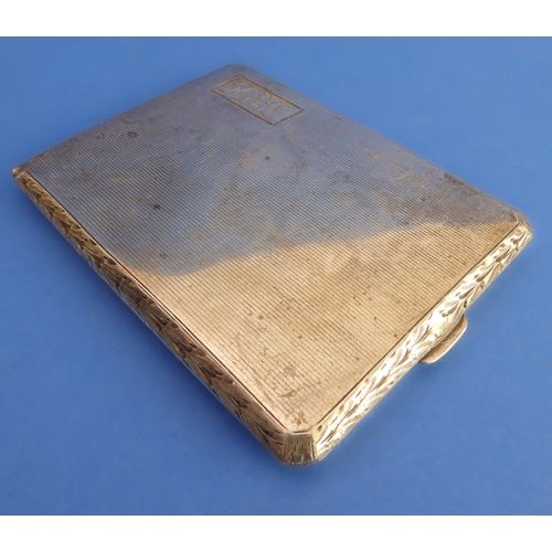 84 - An early 20th century white metal (marked 'sterling') cigarette case: engine-turned decoration and e... 