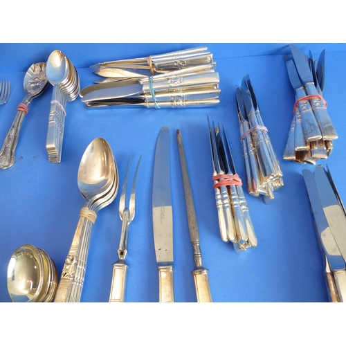 97 - A large Community Plate cutlery service comprising various knives, forks, spoons and a meat carving ... 