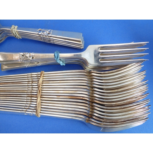 97 - A large Community Plate cutlery service comprising various knives, forks, spoons and a meat carving ... 