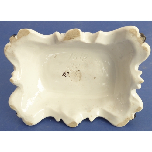 19 - A late 19th century German porcelain fairing match-holder modelled as a brewer sampling beer