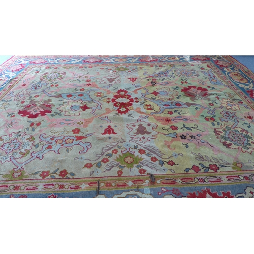 250 - A large hand-knotted Ushak style carpet (possibly Donegal, Arts & Crafts); the light lime-green pred... 