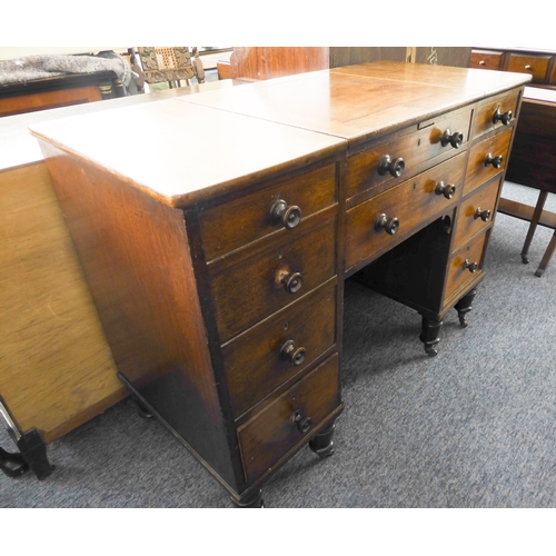 339 - An unusual early 19th century mahogany desk; the central square section with cleating sliding forwar... 