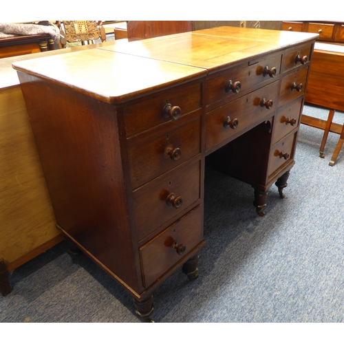 339 - An unusual early 19th century mahogany desk; the central square section with cleating sliding forwar... 