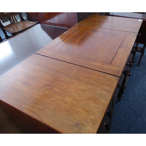 339 - An unusual early 19th century mahogany desk; the central square section with cleating sliding forwar... 