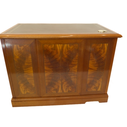 349 - A flame veneered mahogany office style side cabinet, the leathered moulded top above two flush side ... 