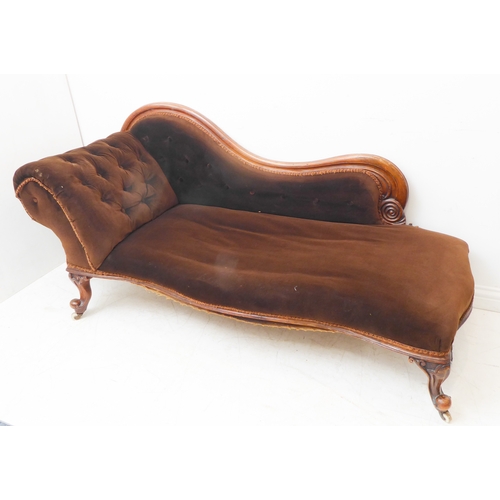 379 - A mid-19th century mahogany show-wood-framed chaise longue; scrolling back, button-back headrest and... 