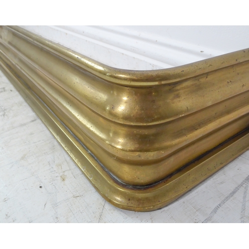 76 - A large 19th century brass fire-curb (167cm) together with a similar period smaller pierced example ... 