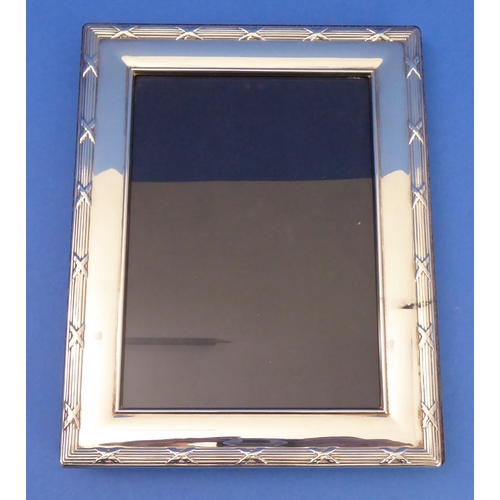 85 - Two Carrs silver-plated easel picture frames with wooden backs (32 x 27cm and 22.5 x 7.5cm)