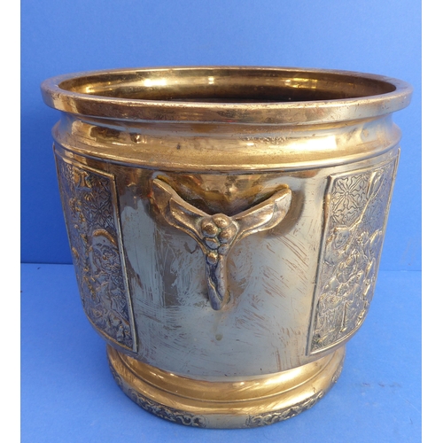 71 - A heavy 19th century polished brass two-handled planter (probably Japanese) decorated in low relief ... 