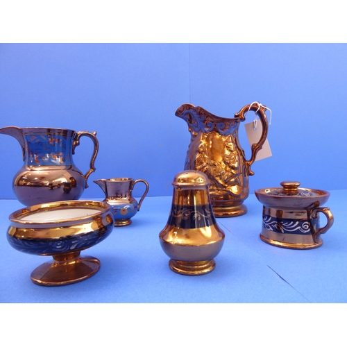 11 - A small selection of 19th and early 20th century Welsh copper lustre to include jugs, a mustard, pep... 