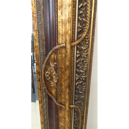 238 - A large and extremally elaborate gilt-framed wall-hanging looking glass in 19th century style (good ... 