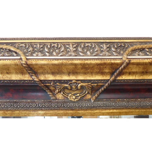 238 - A large and extremally elaborate gilt-framed wall-hanging looking glass in 19th century style (good ... 