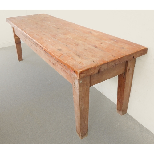 385A - A early 20th century pine farmhouse style kitchen table on square tapering legs (220cm wide x 77cm d... 