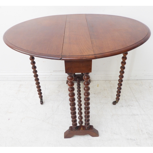 390B - An early 20th century oval topped walnut Sutherland style table on bobbin-turned legs (81cm leaves u... 