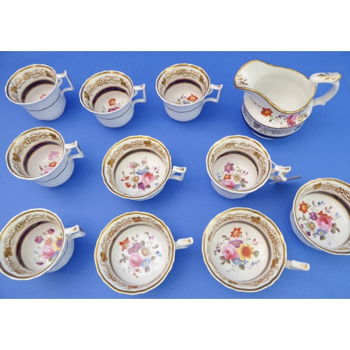 6 - A 19th century part tea service hand-gilded and decorated in enamels with floral sprays:
  2 x 25 cm... 