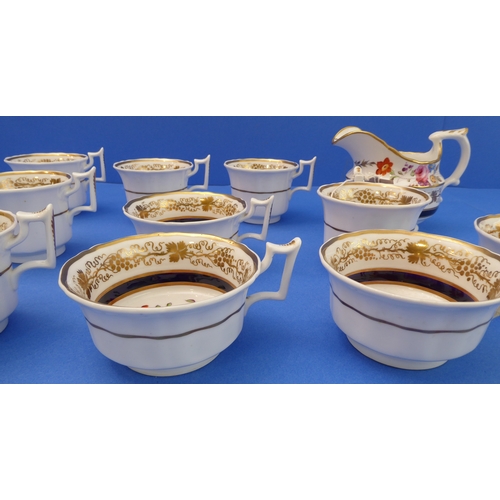 6 - A 19th century part tea service hand-gilded and decorated in enamels with floral sprays:
  2 x 25 cm... 