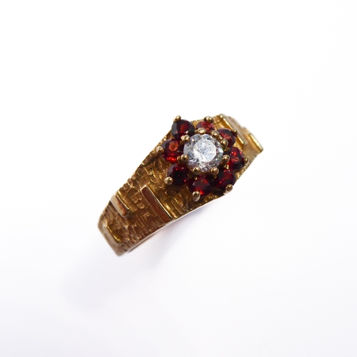 127 - A 9-carat gold and ruby cluster ring, ring size M/N