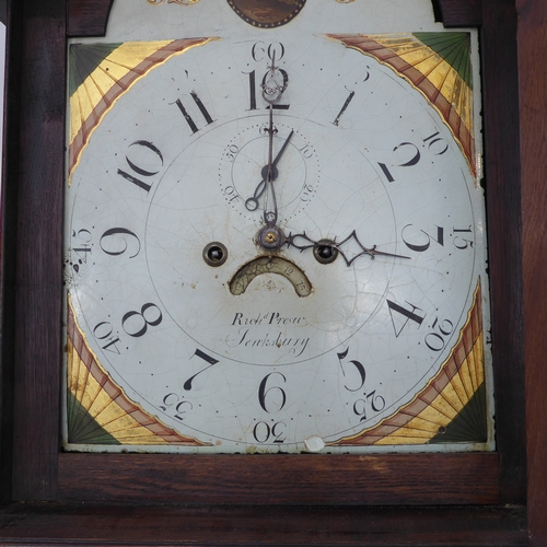 162 - An early 19th century oak-cased eight-day longcase clock: the broken swan-neck pediment above a thir... 