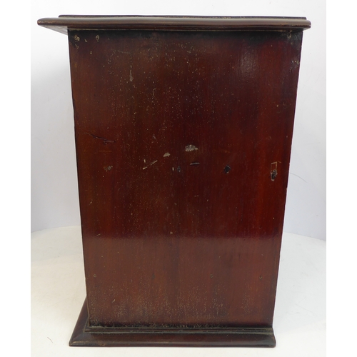 202A - A late 19th/early 20th century mahogany table cabinet: the moulded top above two glazed doors enclos... 