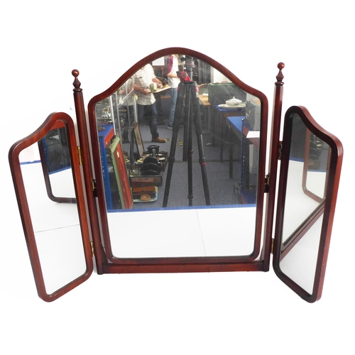 236 - A mahogany triple dressing table mirror with arched top (64cm high)