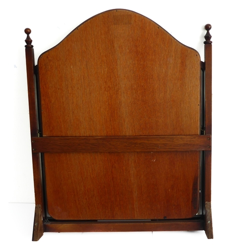 236 - A mahogany triple dressing table mirror with arched top (64cm high)